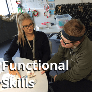A student and tutor completing maths worksheets